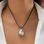 Minimalist Silver Teardrop Pendant with Black Cord for Chic Style Carousel 1