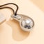 Minimalist Silver Teardrop Pendant with Black Cord for Chic Style Carousel 2
