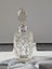 Antique/vintage crystal perfume bottle with stopper and hallmarked silver cuff. Carousel 4