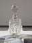 Antique/vintage crystal perfume bottle with stopper and hallmarked silver cuff. Carousel 5