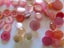 A selection of 150 pink pearly lustre vintage buttons all sizes, tones some sets Carousel 4