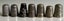 Carved Matai acorn & bakelite needle holders plus thimbles Carousel 7