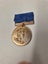 commemorative medal for Queen Elizabeth II's visit to New Zealand in 1953-54. Carousel 1