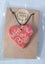 Handmade ceramic heart necklace. Carousel 1