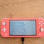Nintendo Switch Lite - Coral Pink - Boxed Carousel 6