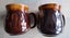 Two Crown Lynn 1160 coffee mugs - one marked 'A' on bottom Carousel 1
