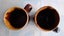 Two Crown Lynn 1160 coffee mugs - one marked 'A' on bottom Carousel 2