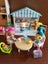 Wooden doll house and a cafe with dolls and accessories Carousel 7