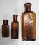 3 x Auckland coloured glass chemist bottles Carousel 1