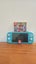 Nintendo Switch Lite + Mario Odyssey Carousel 1