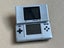 2x Silver Original Nintendo DS + R4 Cartridge Carousel 5