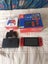 Mario Nintendo switch with dock and Mario controller Carousel 1