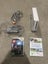 Wii console + 2 games Carousel 1