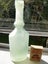 Cloudy well-shaped vintage bottle Carousel 1