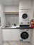 Handle-less Acrylic White Laundry Unit – Built-in Ironing Board, Pull-Out Hamper Carousel 7