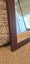 Brown plumbline timber mirror. Few scuffs. 50 x 67cm Carousel 2