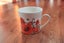 Sorrento Cup and saucer - orange - worn Carousel 1