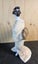 Hakata doll. A traditional clay Doll from Fukuoka. Unglazed white clay. Carousel 9