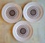 Three brown Telstar on Apollo dinner plates - 25.5cms Carousel 1