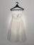 White mid-length strapless dress Carousel 1