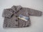 Jacket with a collar handknitted in double knit wool. Carousel 1