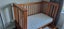 Cot - solid timber with sliding front rail and storage drawer Carousel 4