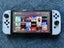 Nintendo Switch OLED + Skull & Co NEOGrip (+accessories) Carousel 1