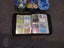 Pokemon collection mixed - approx 300 cards, 3 tin cases and 1 Charizard binder Carousel 5