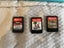 Turquoise Nintendo Switch Lite plus three games and case Carousel 9