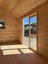 7.0 mx3.6 m assembled cabin with 1.5 mx7.0 verandah & deck. WR cedar cladding. Carousel 2