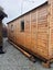 7.0 mx3.6 m assembled cabin with 1.5 mx7.0 verandah & deck. WR cedar cladding. Carousel 5