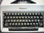 OLYMPIA PORTABLE TYPEWRITER. CASED. Carousel 4