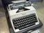 OLYMPIA PORTABLE TYPEWRITER. CASED. Carousel 7