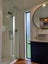 Fully Off-Grid Modern Double Loft Tiny House and Enclosed Deck + Solar Carousel 12