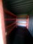 20ft container with heavy-duty shelving and workshop area Carousel 4