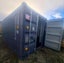20ft container with heavy-duty shelving and workshop area Carousel 1