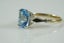 Magnificent ring with emerald cut Blue topaz in 9ct Carousel 4