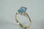 Magnificent ring with emerald cut Blue topaz in 9ct Carousel 6