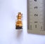 ESTATE MINIATURE FRENCH BOTTLE PENDANT WITH KAURI AMBER/GUM & GARNET INSIDE. Carousel 5