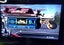 Silver PS2 slim, X2 controllers, boxed buzz game, X2 more games, cords & manual Carousel 11