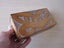 A WOODEN BOX WITH MAORI CARVING ON LID, FELT-LINED INSIDE [LENGTH OF BOX: 175mm] Carousel 1