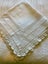 A beautiful very vintage white linen cloth with a deep hand crocheted edging Carousel 5