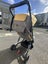 Edward's and Co Otto travel pram with a rain cover and a carryover bag Carousel 6