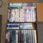 Boxes, boxes and boxes of VHS tapes. Assortment of genres from horrors to comedy Carousel 5