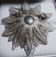 Antique Art Deco period sterling silver filigree starburst brooch Carousel 5
