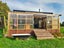 Fully Off-Grid Modern 2 Bedroom Tiny House + Enclosed Deck + Solar Package Carousel 1