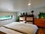 Fully Off-Grid Modern 2 Bedroom Tiny House + Enclosed Deck + Solar Package Carousel 11