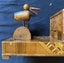 Old wooden cigarette box with bird on top Carousel 4