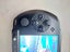 PSP, original charger, 4GB storage card and 9 Games Carousel 5