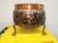 A solid copper pot. Carousel 1